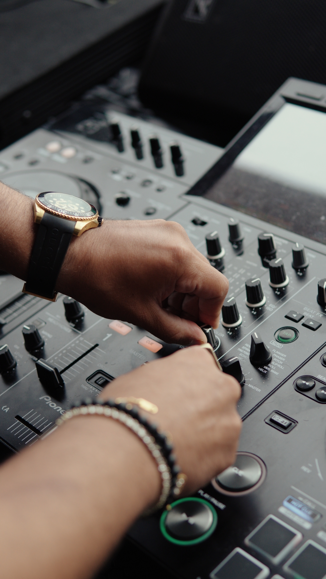 Close-up of FARZY's hands working the mixer