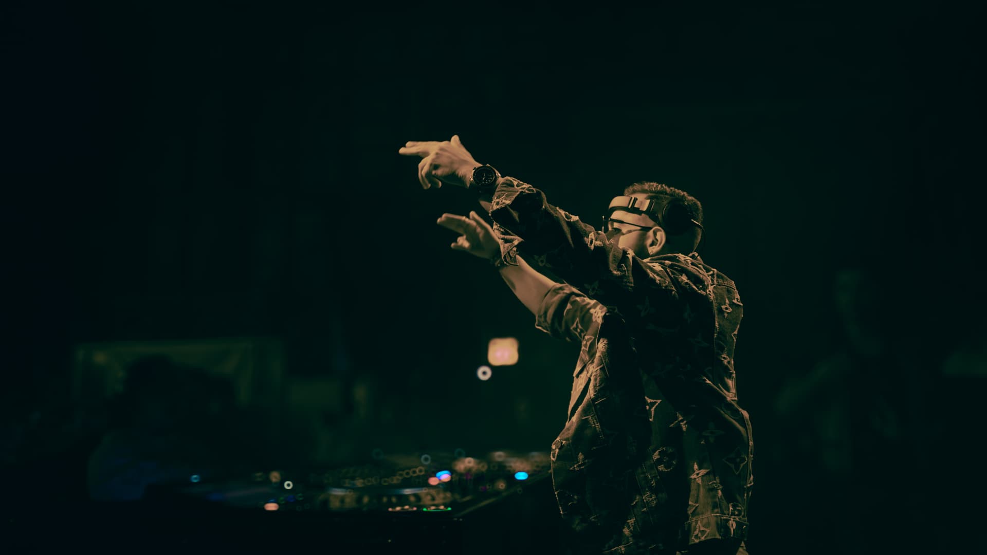 FARZY pointing to the crowd in golden light