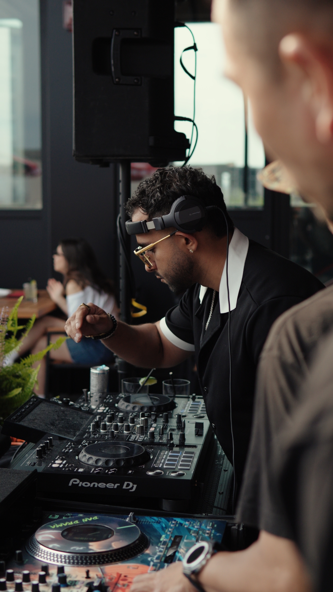 FARZY behind the Pioneer decks at a rooftop lounge set